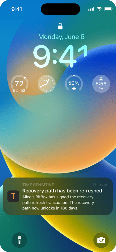 Smartphone lock screen showing a push notification that says that Alice has just signed the transaction as well and that the recovery path has been reset.